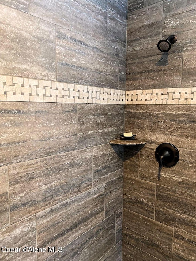 details featuring a tile shower