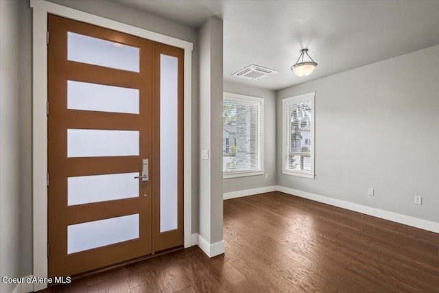 entrance foyer featuring dark hardwood / wood-style floors