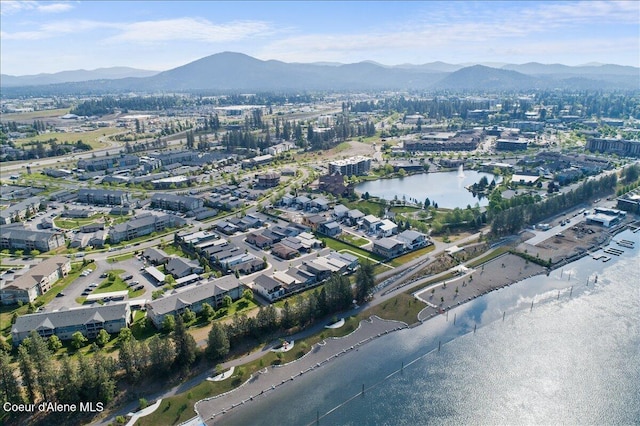 birds eye view of property featuring a water and mountain view