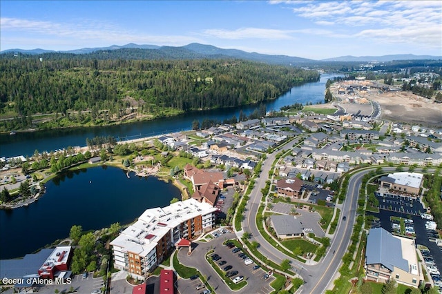 drone / aerial view with a water and mountain view