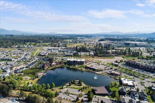 drone / aerial view with a water and mountain view