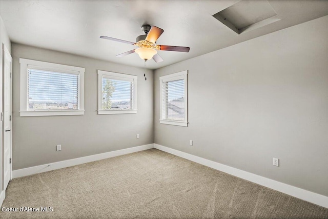 carpeted empty room featuring ceiling fan