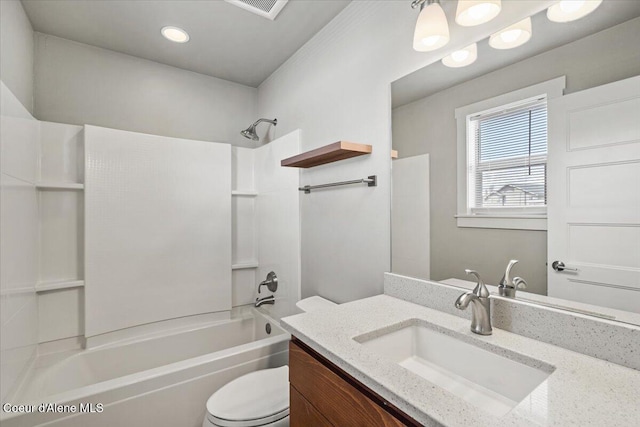 full bathroom featuring toilet, vanity, and  shower combination