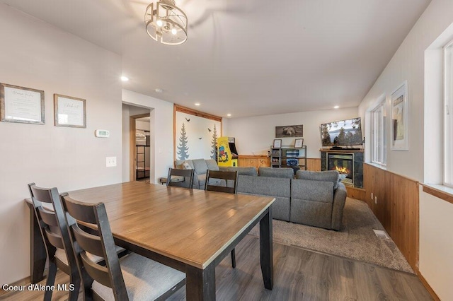 dining space featuring a fireplace and hardwood / wood-style floors