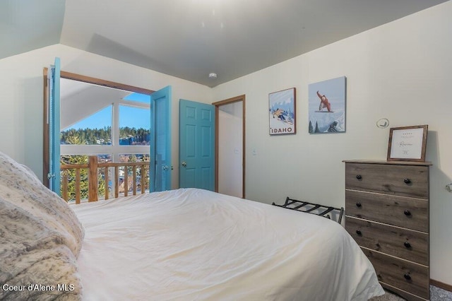 bedroom featuring vaulted ceiling