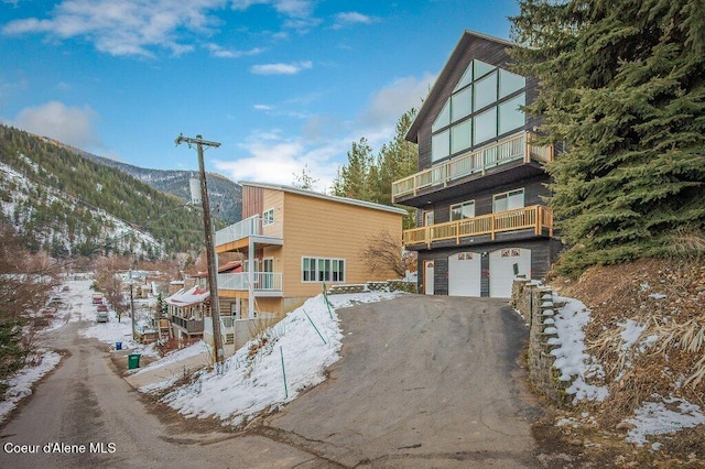 exterior space with a mountain view and a garage