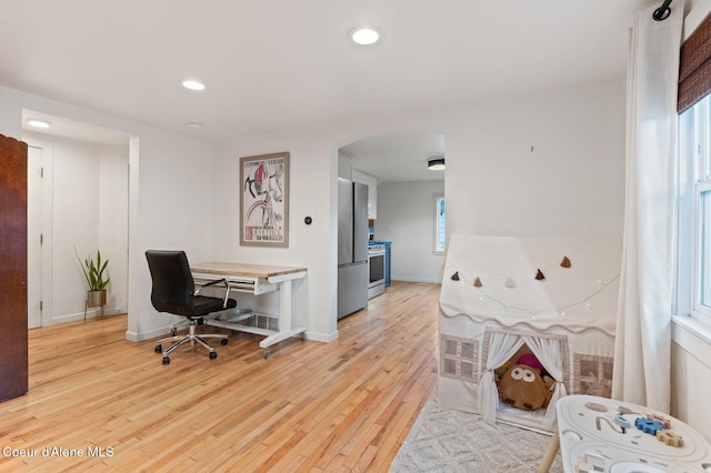 office space with light hardwood / wood-style floors