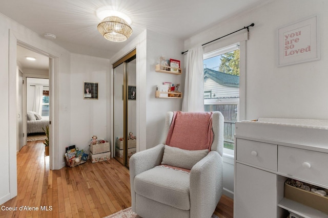 sitting room with light hardwood / wood-style flooring