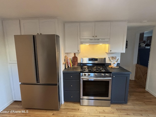 kitchen featuring stainless steel appliances, light hardwood / wood-style flooring, and white cabinets