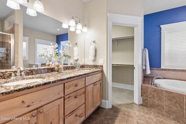 bathroom featuring vanity, tile patterned floors, and independent shower and bath