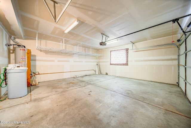 garage with water heater and a garage door opener