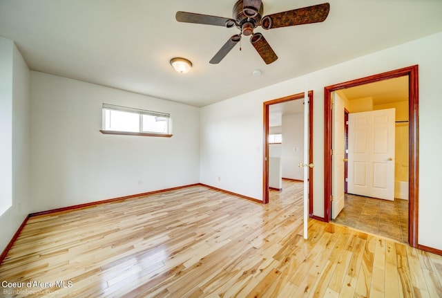 unfurnished bedroom with ceiling fan and hardwood / wood-style floors