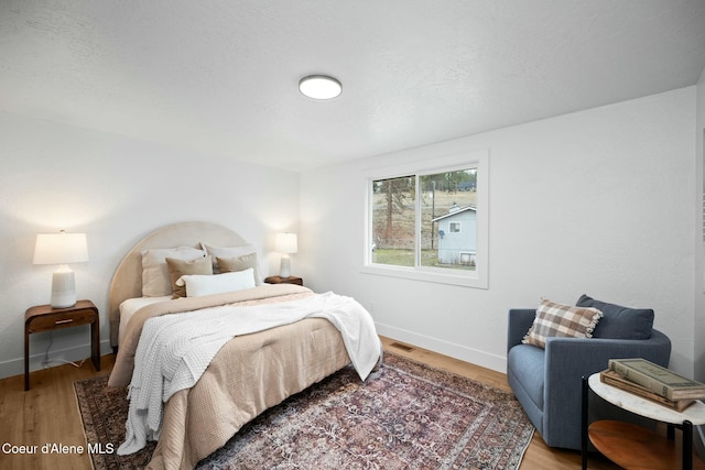 bedroom featuring hardwood / wood-style flooring