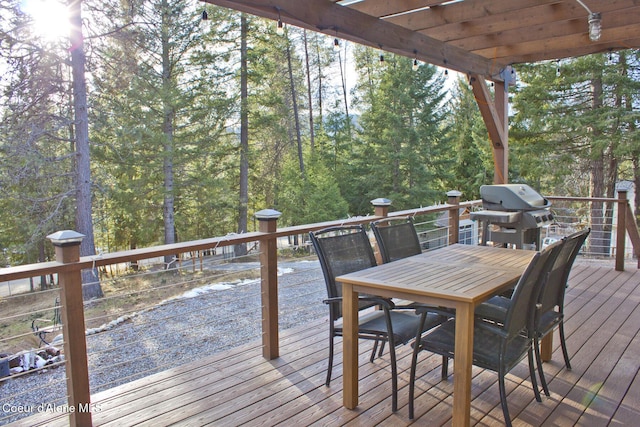 deck featuring a pergola and area for grilling