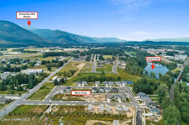 bird's eye view featuring a water and mountain view