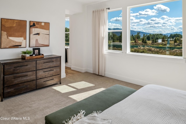 carpeted bedroom featuring a mountain view