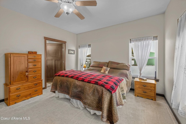 carpeted bedroom with ceiling fan