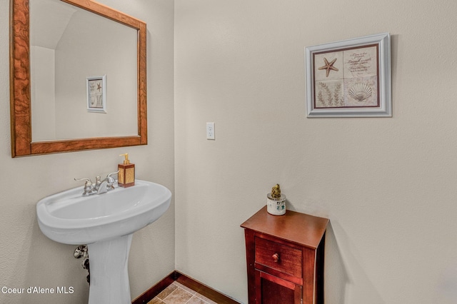 bathroom featuring tile patterned flooring and sink