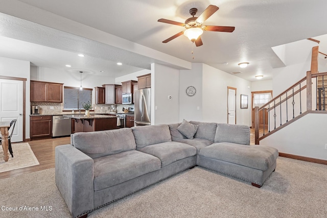 living room featuring ceiling fan