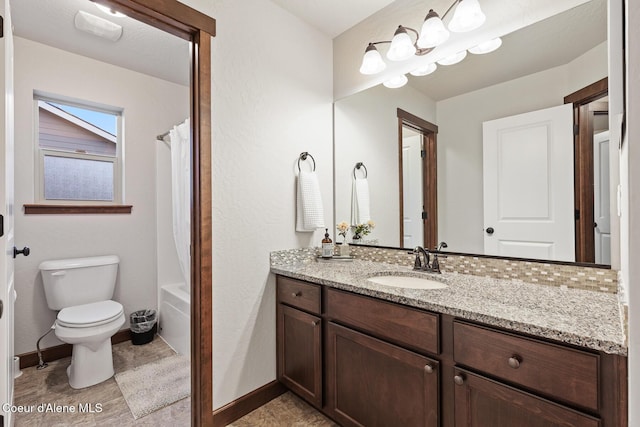 full bathroom featuring toilet, shower / tub combo, and vanity