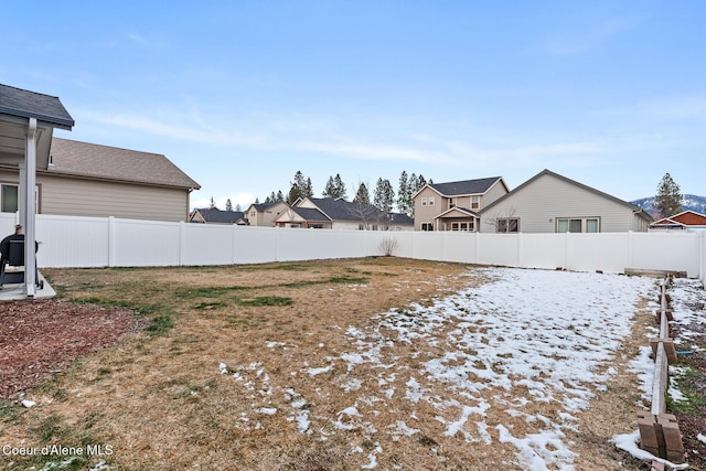 view of yard covered in snow