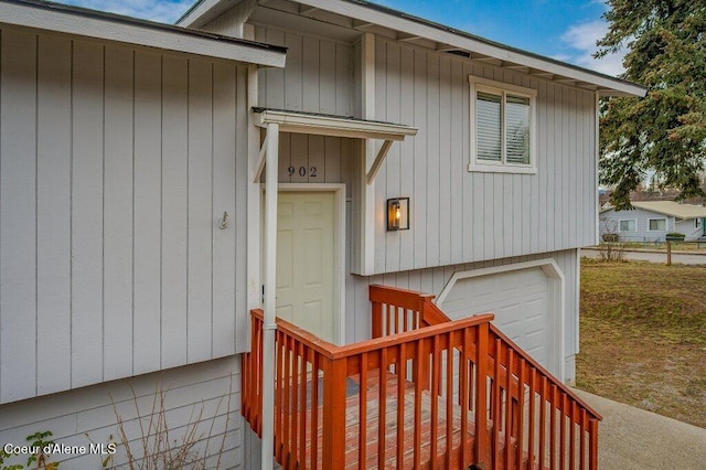 view of exterior entry featuring a garage