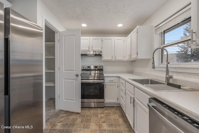 kitchen with white cabinetry, appliances with stainless steel finishes, and sink