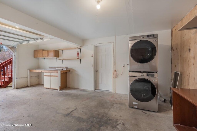 laundry area with stacked washer / dryer