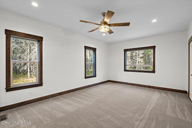 empty room featuring carpet and ceiling fan