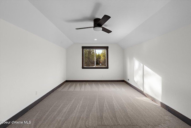 bonus room featuring lofted ceiling, ceiling fan, and light carpet