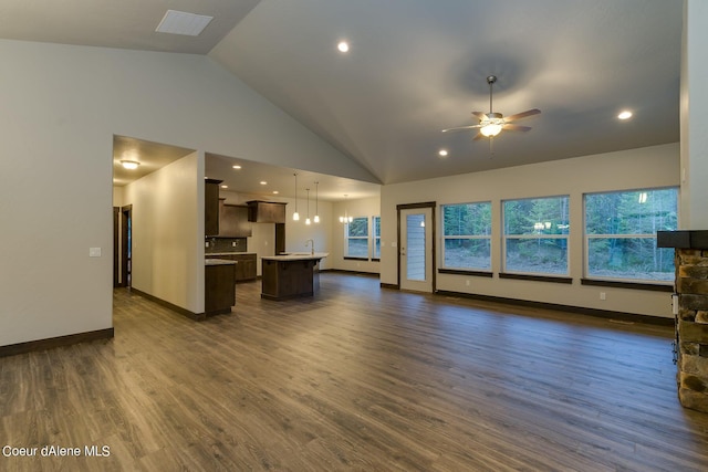 unfurnished living room featuring high vaulted ceiling, ceiling fan, dark wood-type flooring, and sink