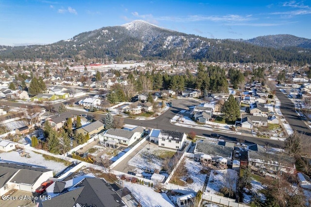 birds eye view of property with a mountain view