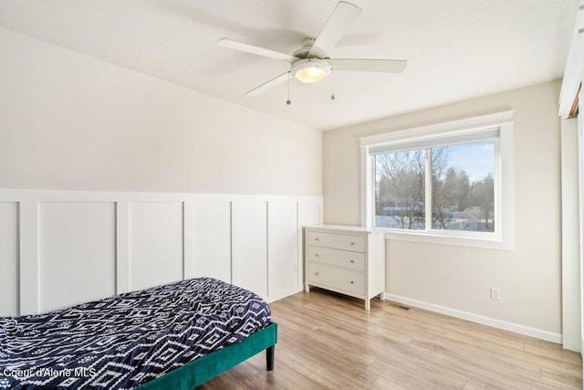 bedroom featuring ceiling fan and light hardwood / wood-style flooring