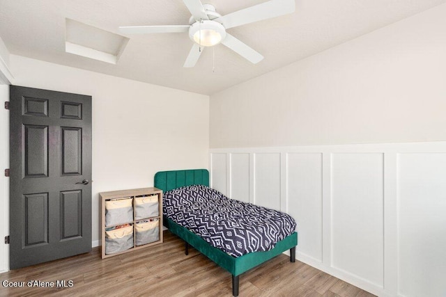 bedroom featuring hardwood / wood-style flooring and ceiling fan