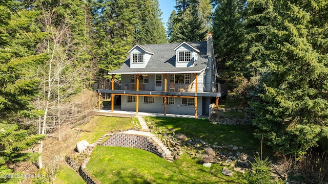 19503 E Hayden Lake Rd, Hayden, ID 83835 - view of front of property with a front lawn and a patio area