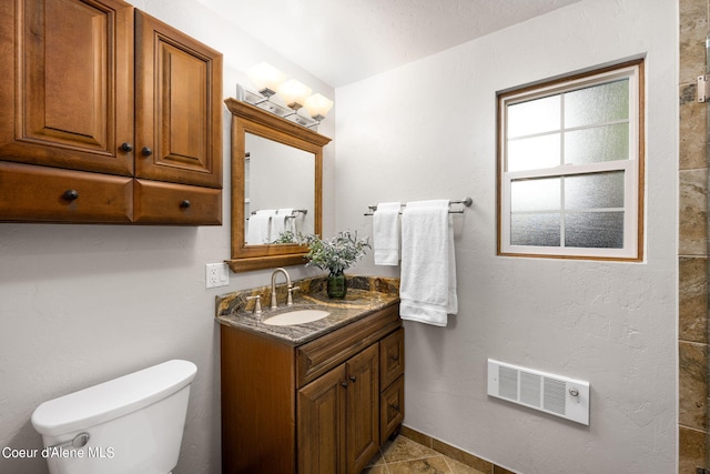 19503 E Hayden Lake Rd, Hayden, ID 83835 - bathroom with toilet, vanity, and visible vents