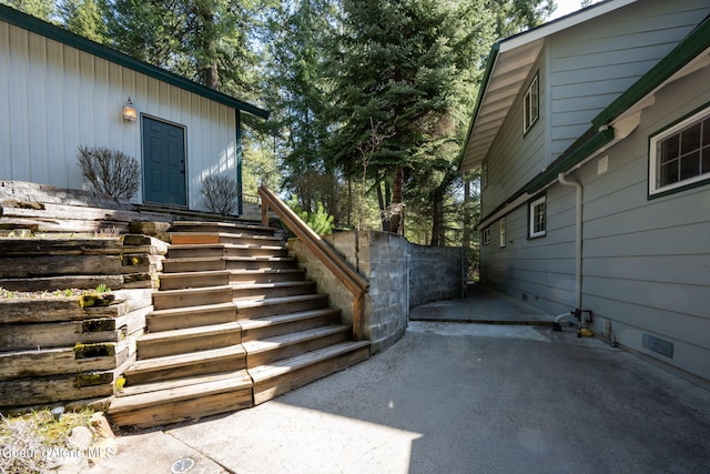 19503 E Hayden Lake Rd, Hayden, ID 83835 - view of side of property with stairs and a patio