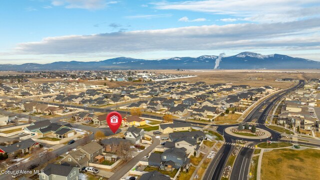 birds eye view of property featuring a mountain view