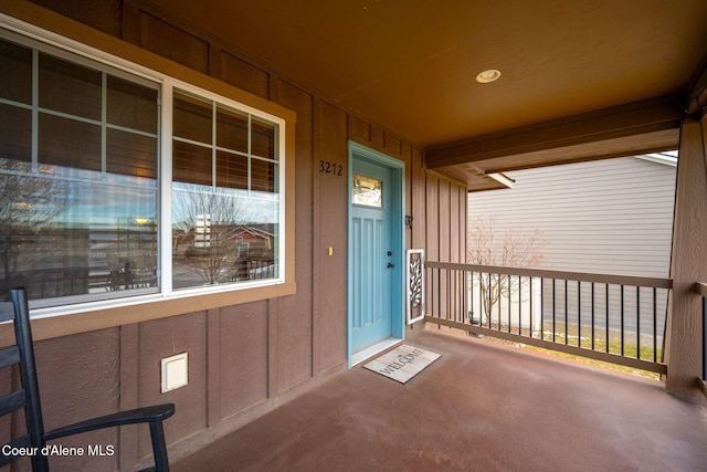 entrance to property featuring a porch