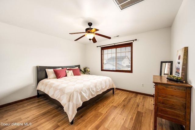 bedroom with ceiling fan and light wood-type flooring