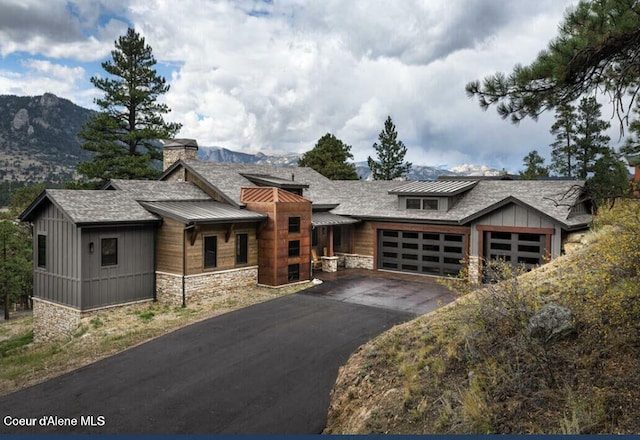 view of front of home featuring a garage and a mountain view