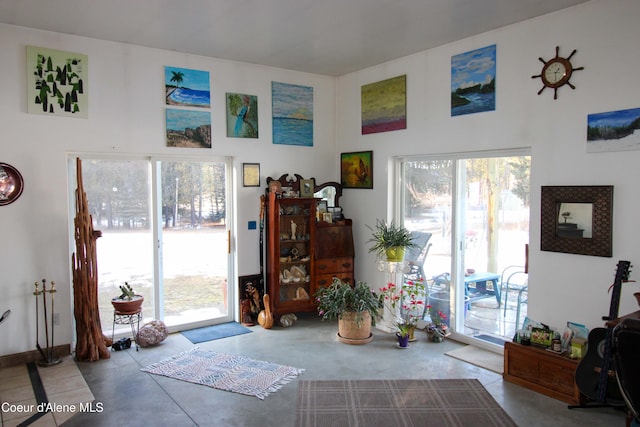 doorway to outside featuring concrete flooring