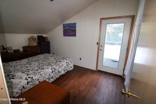 bedroom with dark wood-type flooring and vaulted ceiling