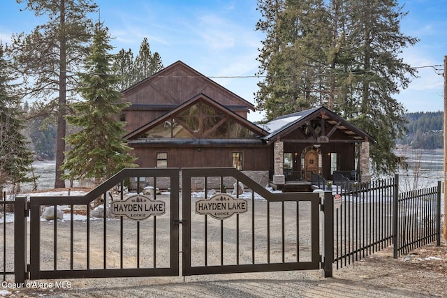 view of gate with a fenced front yard