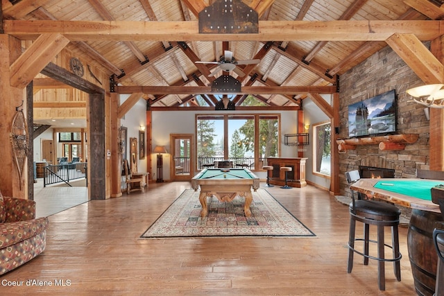 playroom with wooden ceiling, light wood-style floors, beam ceiling, and pool table