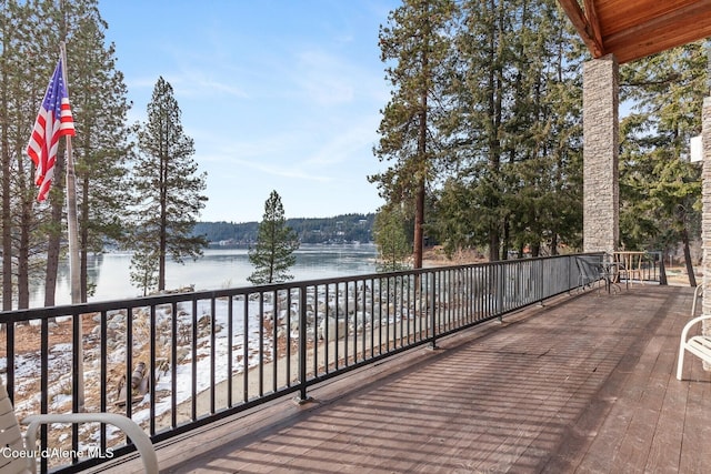 wooden deck with a water view