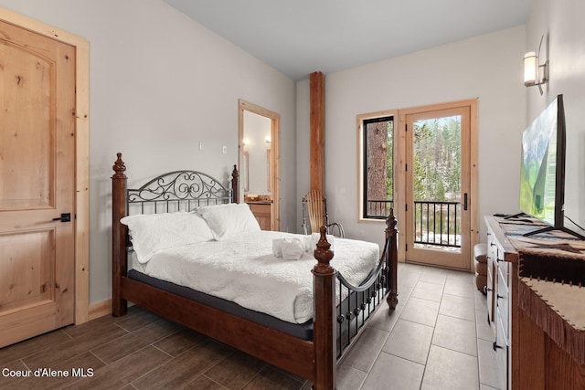 bedroom featuring access to outside and dark wood-style flooring