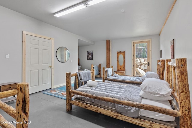 bedroom with finished concrete floors