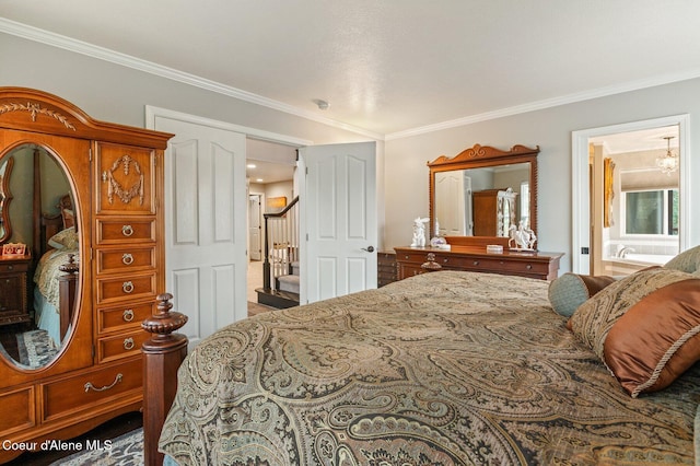 bedroom with crown molding and ensuite bath