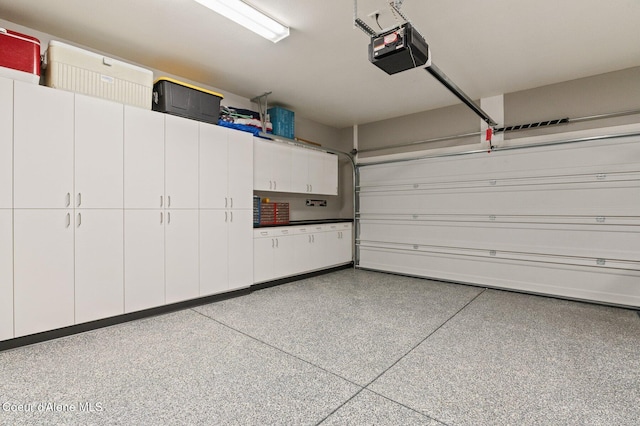 garage featuring a garage door opener